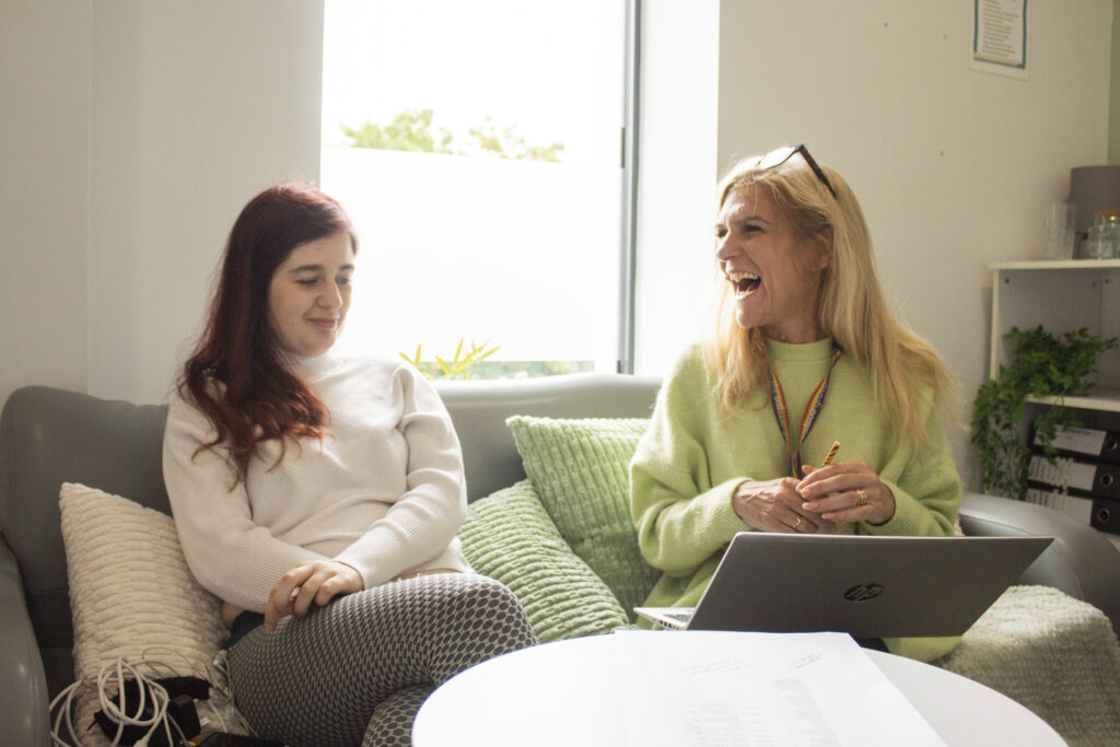 A customer in a meeting with a support worker